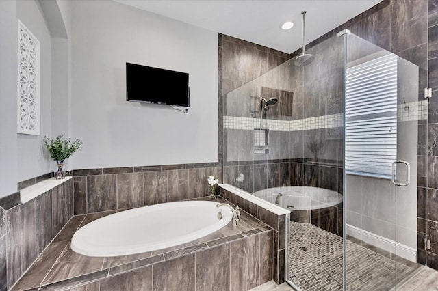 bathroom featuring plus walk in shower