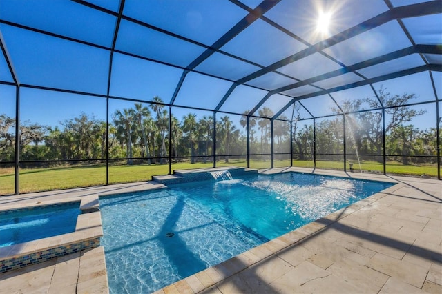 view of swimming pool with a yard, a lanai, pool water feature, a patio area, and an in ground hot tub