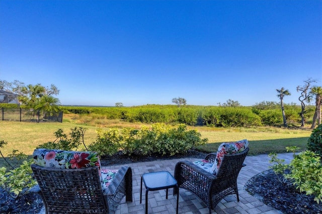 view of patio / terrace with a rural view