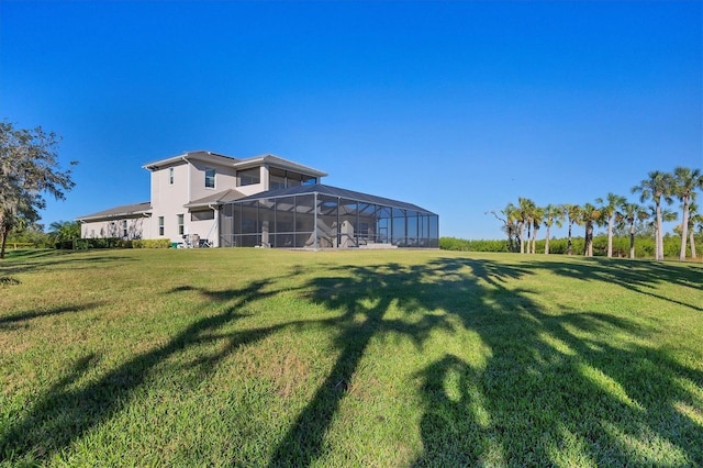 view of yard featuring glass enclosure