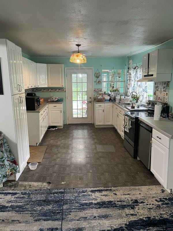 kitchen featuring decorative backsplash, appliances with stainless steel finishes, dark parquet floors, and white cabinetry