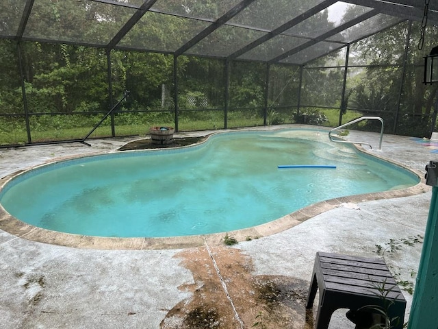 view of pool featuring a lanai and a patio area