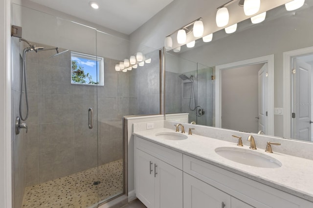 bathroom featuring vanity and an enclosed shower