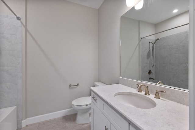 bathroom featuring tile patterned flooring, vanity, and toilet