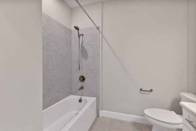 full bathroom featuring tiled shower / bath, tile patterned flooring, vanity, and toilet