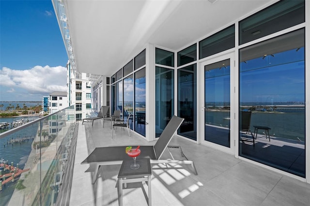 balcony featuring a water view