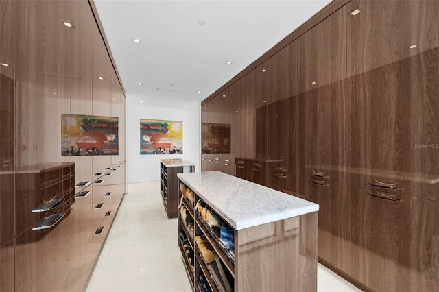 kitchen featuring light tile patterned floors and a center island