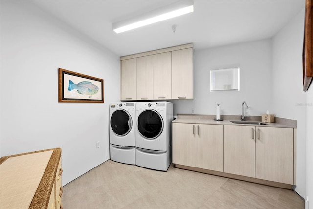 laundry area with cabinets, separate washer and dryer, sink, and light carpet