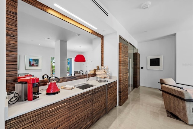 interior space with light tile patterned floors and sink