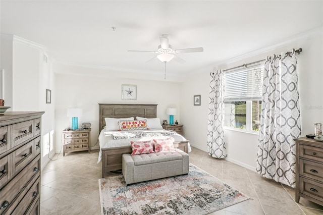 bedroom featuring light tile patterned floors, ornamental molding, a ceiling fan, and baseboards