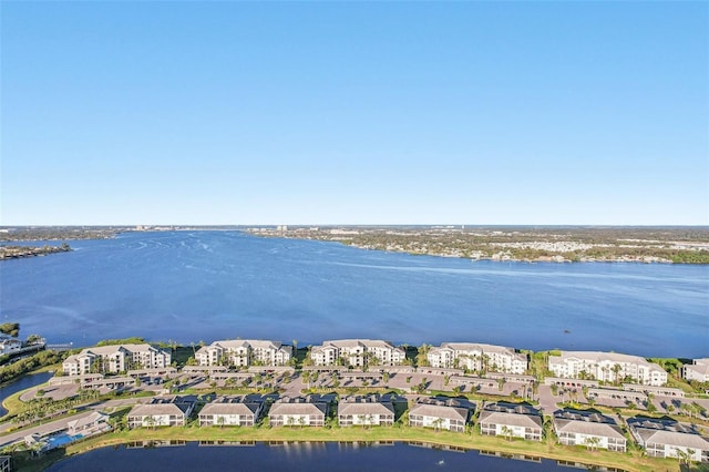 birds eye view of property featuring a water view and a residential view