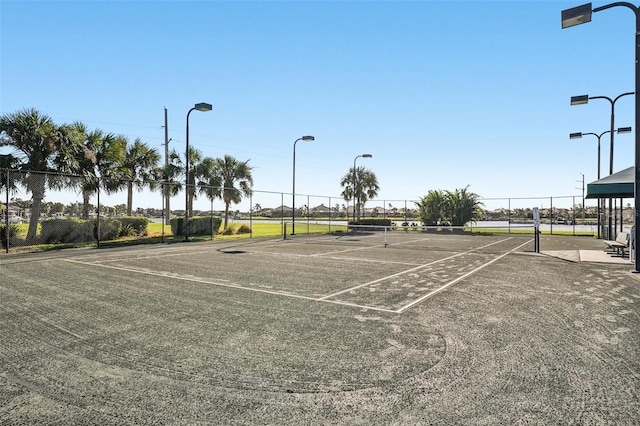 view of sport court with fence