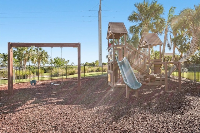 view of playground featuring fence