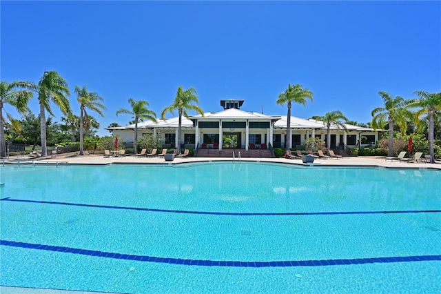 community pool with a patio area