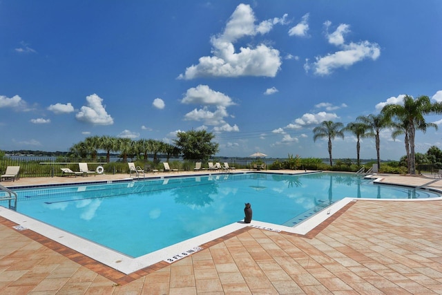 view of swimming pool with a patio