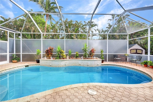 view of pool featuring glass enclosure