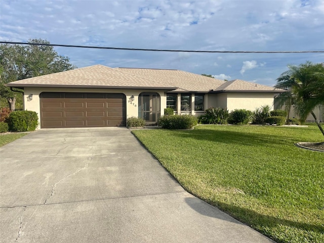 single story home featuring a garage and a front yard