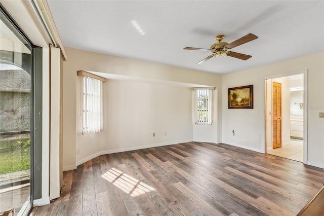 empty room featuring hardwood / wood-style floors and ceiling fan