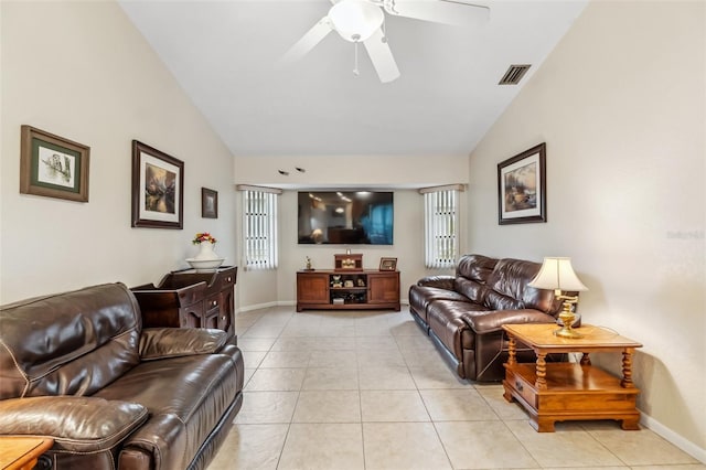 tiled living room featuring ceiling fan and lofted ceiling