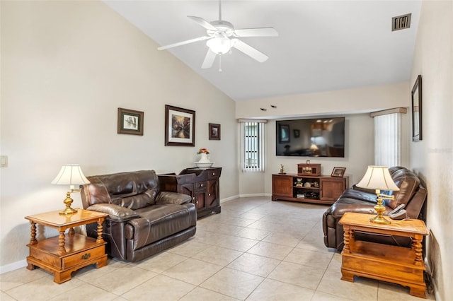 living room with light tile patterned flooring, vaulted ceiling, and ceiling fan