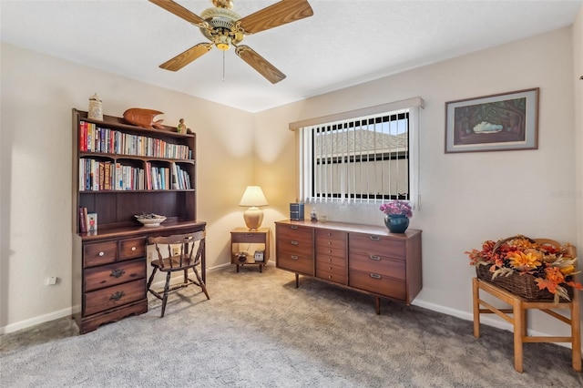 living area with light carpet and ceiling fan