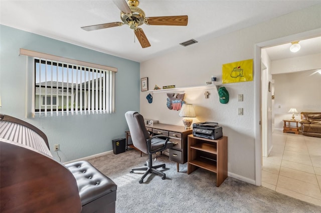 carpeted home office with ceiling fan