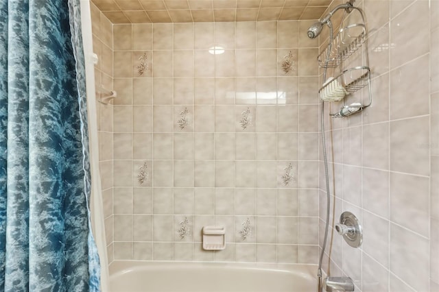 bathroom with shower / bath combo