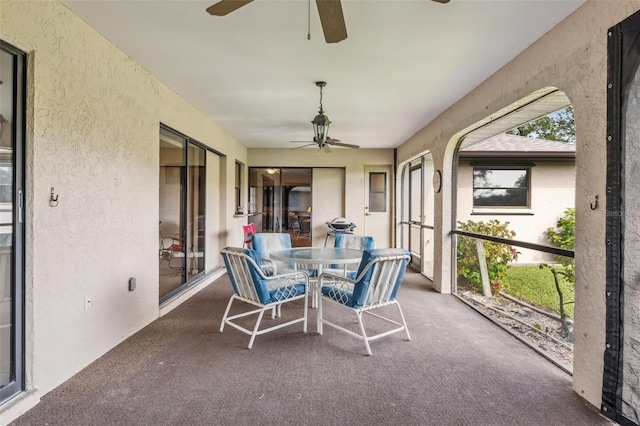 sunroom / solarium with ceiling fan