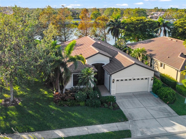 birds eye view of property with a water view