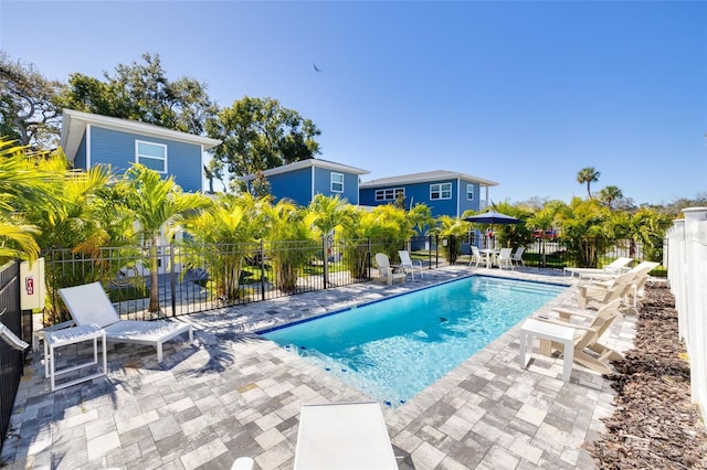 719 Douglas Ave, Dunedin, FL 34698 - view of swimming pool featuring a patio area