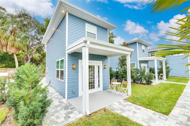 rear view of house with a yard