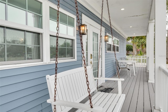 wooden terrace with a porch