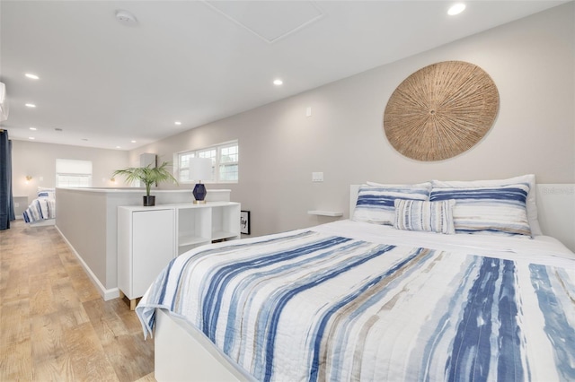 bedroom with light hardwood / wood-style floors