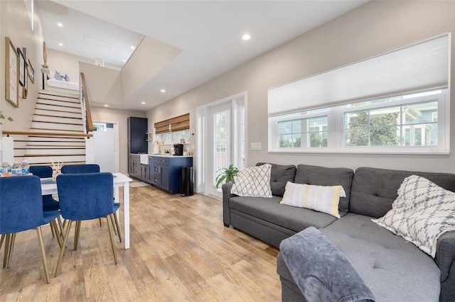 719 Douglas Ave, Dunedin, FL 34698 - living room with light wood-type flooring, stairs, and recessed lighting