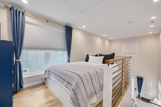 bedroom with light hardwood / wood-style flooring