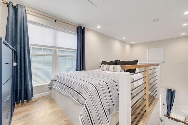 bedroom with light hardwood / wood-style flooring