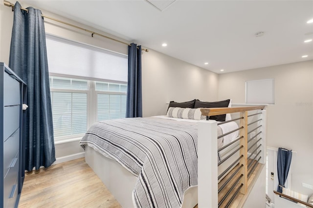 719 Douglas Ave, Dunedin, FL 34698 - bedroom featuring light wood-type flooring, recessed lighting, and baseboards