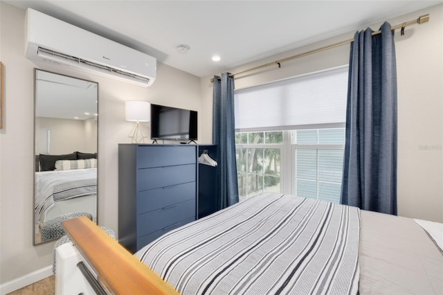 bedroom featuring a wall mounted air conditioner