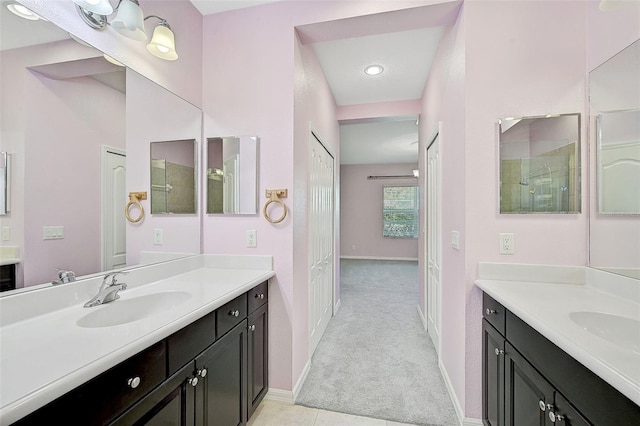 bathroom with a shower and vanity