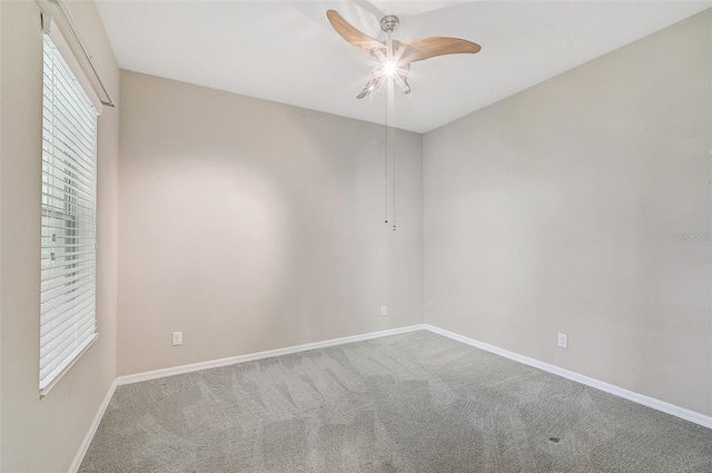 carpeted empty room with ceiling fan