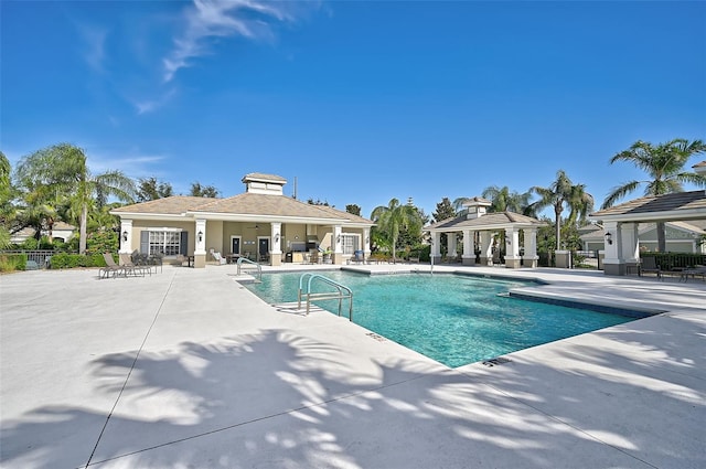 view of pool featuring a patio