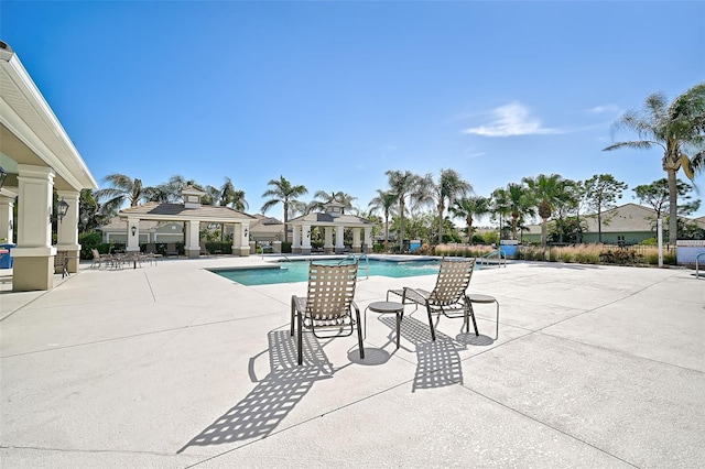 view of pool with a gazebo and a patio