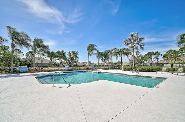 view of swimming pool featuring a patio area