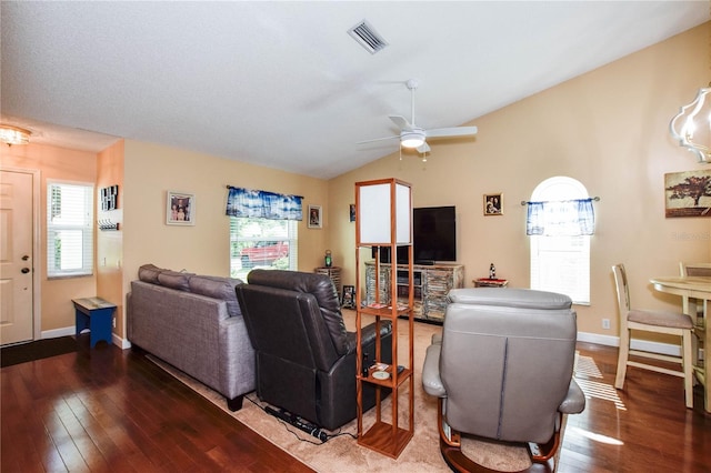 living room featuring ceiling fan, lofted ceiling, and dark hardwood / wood-style flooring