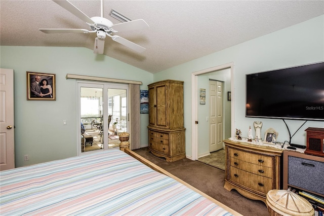 bedroom featuring ceiling fan, vaulted ceiling, dark colored carpet, and a textured ceiling