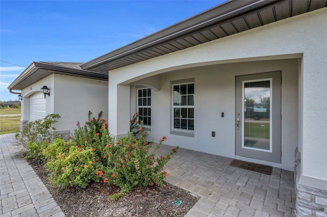 property entrance featuring a garage