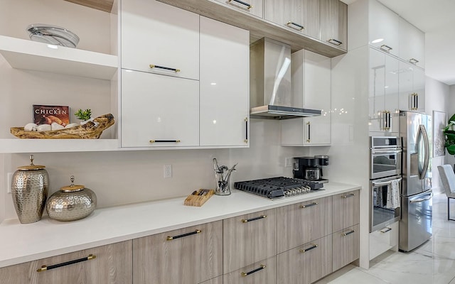 kitchen with stainless steel appliances and wall chimney range hood