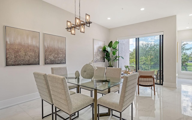 dining space with a chandelier