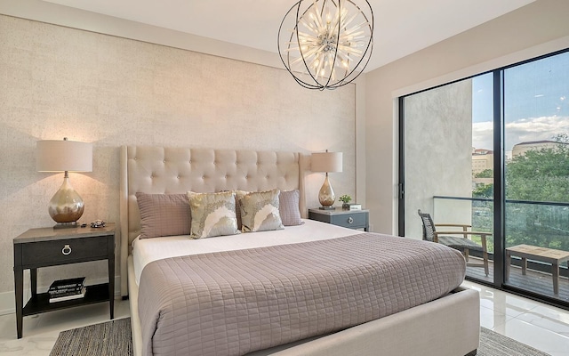 bedroom featuring access to outside and a chandelier
