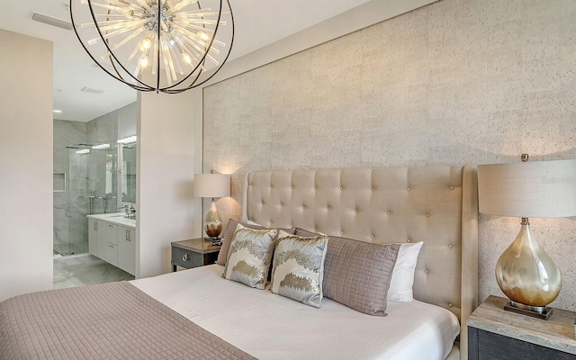 bedroom featuring ensuite bathroom, sink, and a notable chandelier